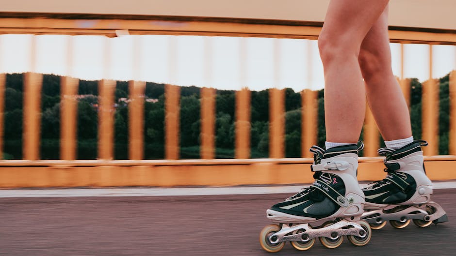 Image depicting a person rollerblading energetically, showcasing the full-body engagement and motion associated with the activity.